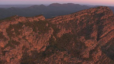 Misty, forested mountain peaks in the Flinder Ranges at dusk