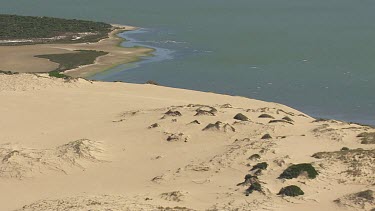 Sunlit, sandy coast in Coorong National Park