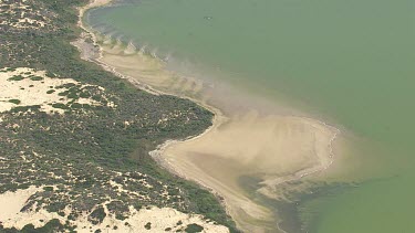 Green water and the sandy coastline in Coorong National Park
