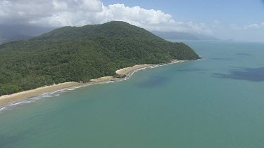 Aerial view of the ocean and a forested coast in Daintree National Park