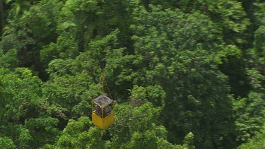 Travelling in a canopy crane over dense forest in Daintree National Park