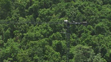 Travelling in a canopy crane over dense forest in Daintree National Park