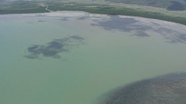 Patches of sand and vegetation in the ocean in Daintree National Park