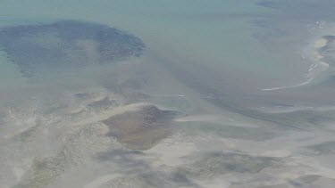 Patches of sand and vegetation in the ocean in Daintree National Park