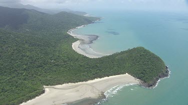 Aerial view of the ocean and a forested coast in Daintree National Park