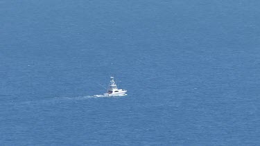 White boat travelling through the ocean in Daintree National Park