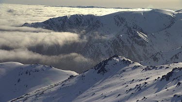 Clouds over a snow-covered mountain range in Australia