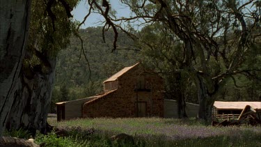 Historic building Wilpena Pound and red gums