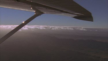 Wilpena Pound aerial. Wing of plane in foreground