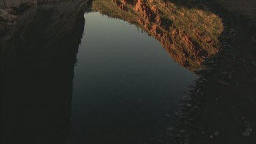 reflection in creek of ridges tilt up