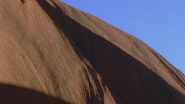 dramatic shadow cast across Uluru