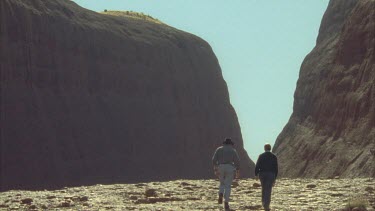 tourist walk up through the bald faces of Kata Juta