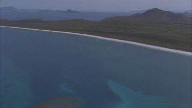 aerials over reef island white sands of Whitehaven beach