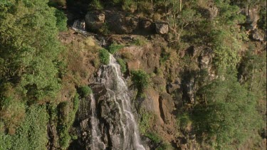 rock face waterfall with water over