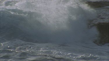 waves breaking on rocks