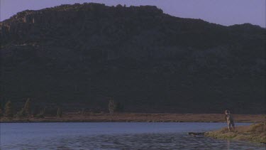 trout fishing at edge of Lake fly fishing