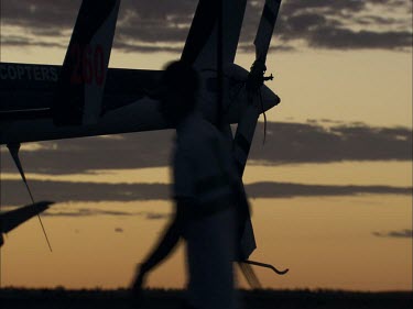 Unloading a helicopter at dusk