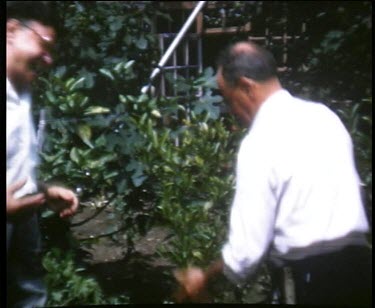 Elderly man dancing in the garden