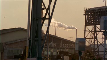 Industrial smoke rises from a factory