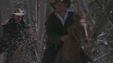 men riding galloping horses
