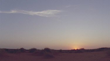 beautiful sunset light coming up over dunes