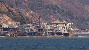Houses on beach, right on the sea. Malibu Southern California.