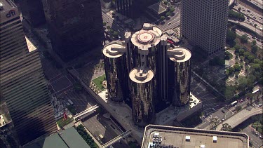 Los Angeles; LA. City skyline. Office towers, office blocks. Skyscrapers; architecture. Roads and traffic. Spaghetti junctions and highways. Lots of cars. CBD