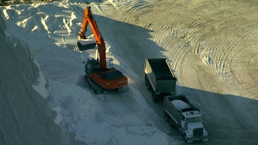 Salt mining and salt processing, manufacture Cheetham salt. Great Australian Bight. Salt produced by solar evaporation from saline or brine waters.  Small triangular mountains of salt scrapped up.