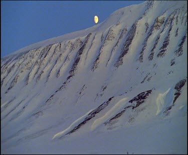 Moon over white landscape