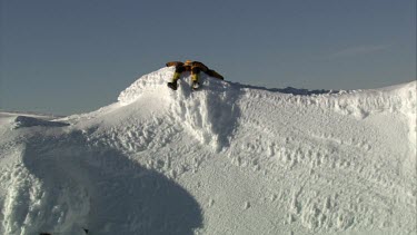 Aerial of Mount Everest: Climber resting on peak