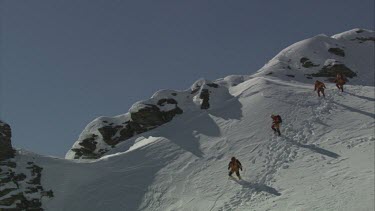 Aerial of Mount Everest: Climber in trouble, another climber is holding and while other is placing oxgen mask