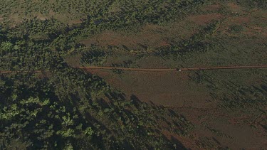 Aerial -Kimberley Region - 4WD on dirt road with people