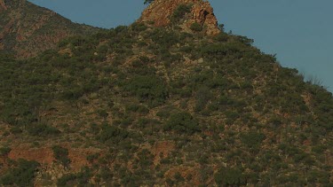 Aerial -Kimberley Region  - pan up from cliff to moon in sky