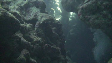 Light shining through an opening in an underwater cave