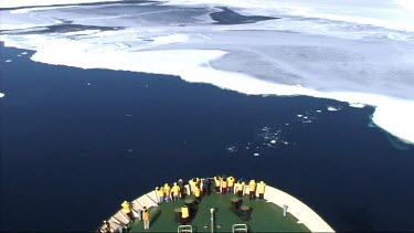 High angle looking down on prow of Russian ice-breaker sailing and breaking the ice in the Weddell Sea, Antarctica. The ice cracks and drifts apart.