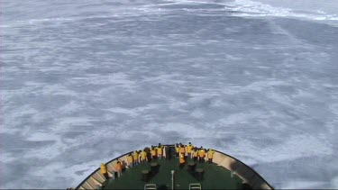 High angle looking down on prow of Russian ice-breaker sailing and breaking the ice in the Weddell Sea, Antarctica. The ice cracks and drifts apart.