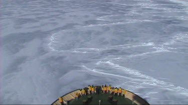 High angle looking down on prow of Russian ice-breaker sailing and breaking the ice in the Weddell Sea, Antarctica. The ice cracks and drifts apart.