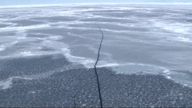 Aerial view of the sea ice on Antarctica breaking up