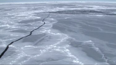 Aerial view of the sea ice on Antarctica breaking up