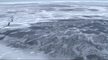 Aerial view of the sea ice on Antarctica breaking up