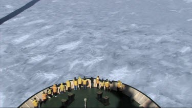 High angle looking down on prow of Russian ice-breaker sailing and breaking the ice in the Weddell Sea, Antarctica. The ice cracks and drifts apart.