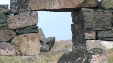 Zoom out from medium to wide shot. Remains of a Viking church near Hvalso, Greenland