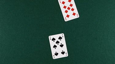 Playing Cards Falling against Green Background, Time Lapse