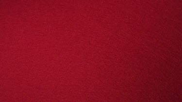 Dice rolling against Red background, slow motion