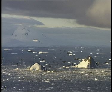 Small jagged peaks emerging from sea