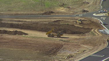 Building construction site, preparing the land. Building the roads. Medium shot.