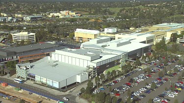 Shopping Centre Mall. Parking lot with lots of cars. Medium Shot.