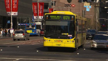 Yellow bus, central Sydney street.