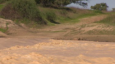 Flooding Diamantina River in middle of Simpson Desert. See river bank.