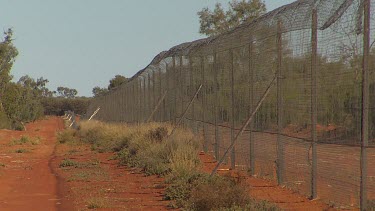 Barbed wire Bilby fence designed to keep out predators (long shot)